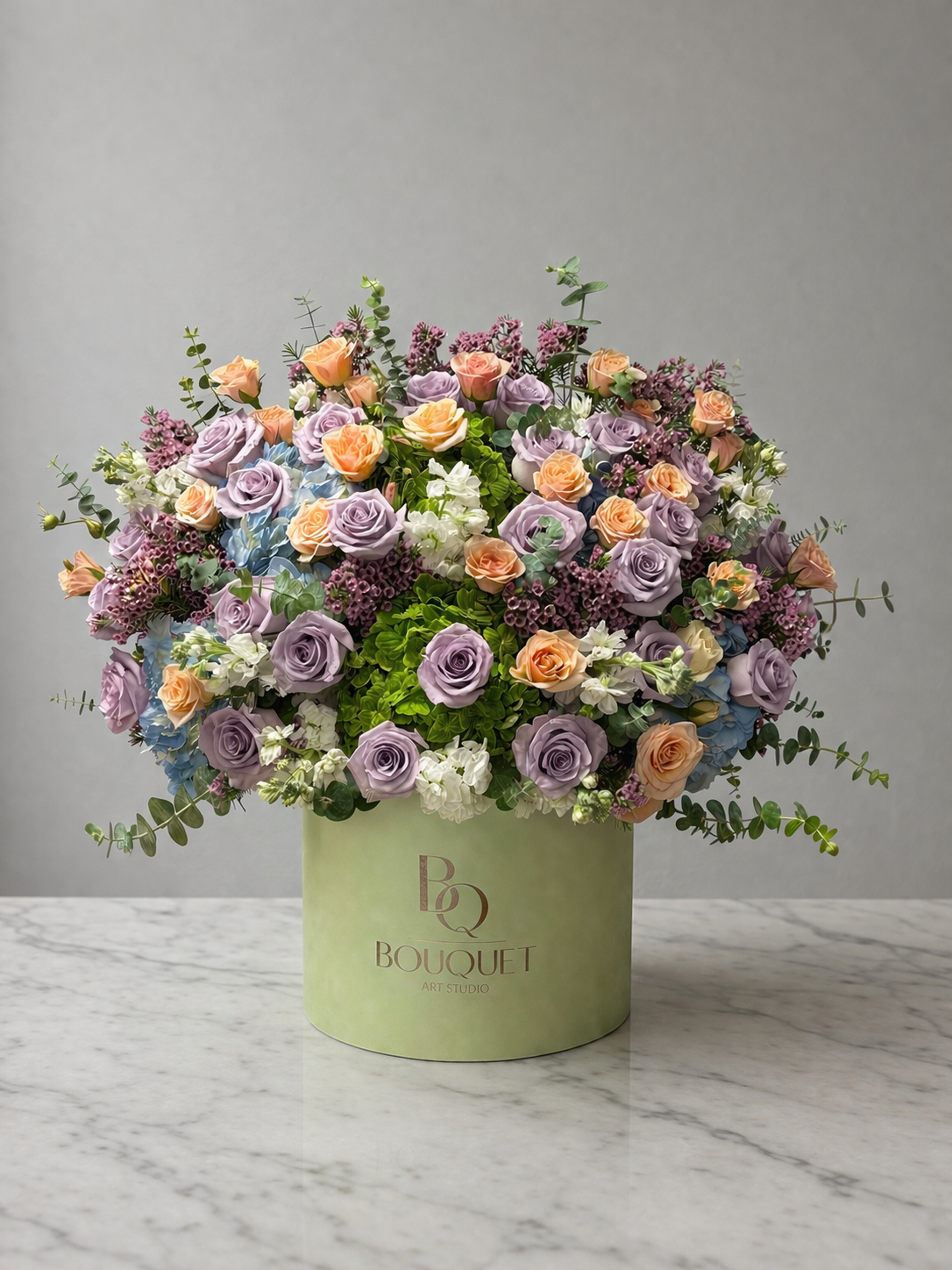 Luxury flower box with lavender roses, peach roses, seasonal flowers, and eucalyptus by BQ Bouquet, Irvine, California.